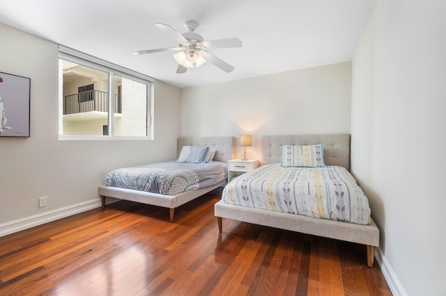 bedroom with hardwood / wood-style flooring and ceiling fan