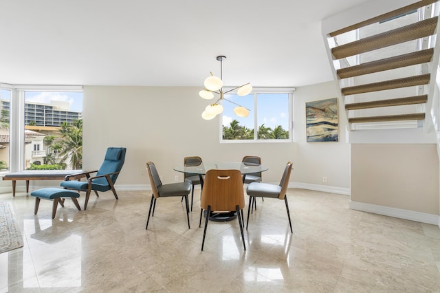 dining space featuring an inviting chandelier