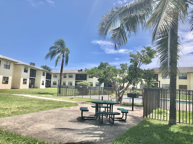 view of property's community with a lawn