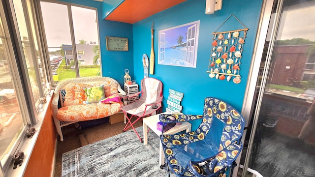 sitting room featuring carpet and a wealth of natural light