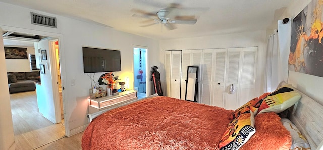 bedroom featuring ceiling fan and light hardwood / wood-style flooring