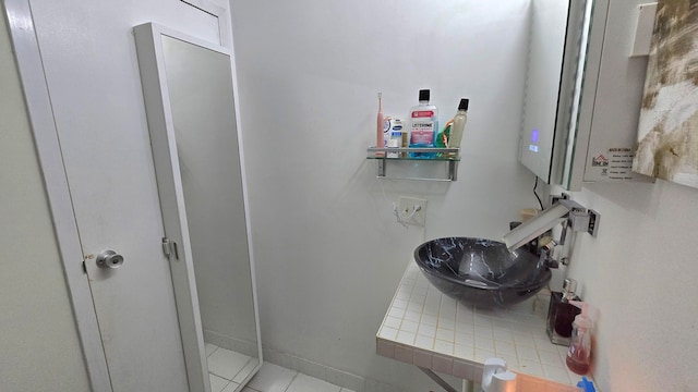 bathroom with sink and tile patterned floors