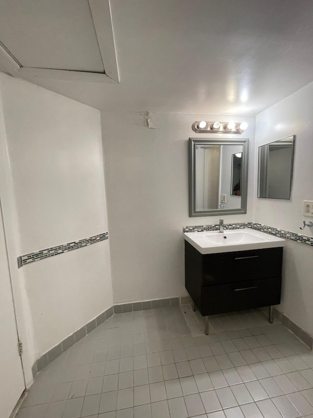 bathroom featuring tile patterned floors and vanity