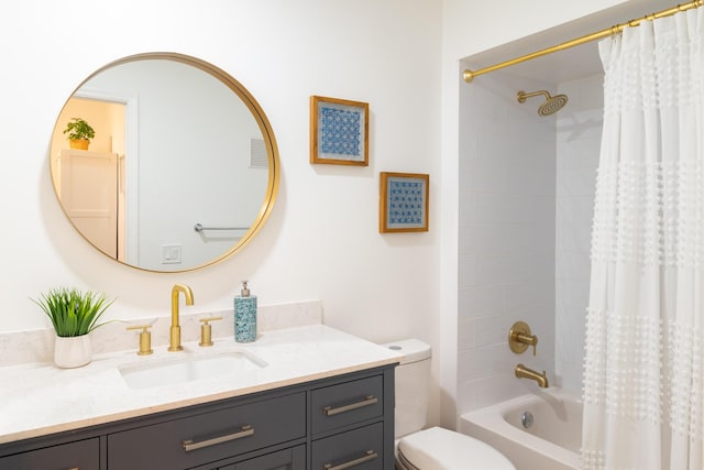 full bathroom with vanity, shower / tub combo with curtain, and toilet