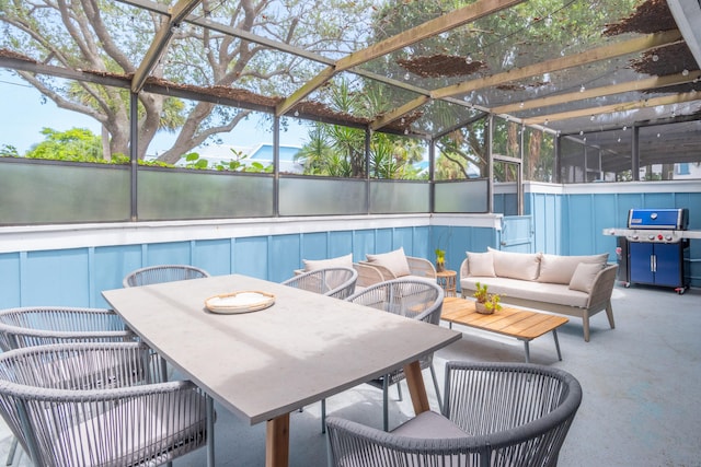 view of swimming pool with a patio, glass enclosure, area for grilling, and an outdoor living space