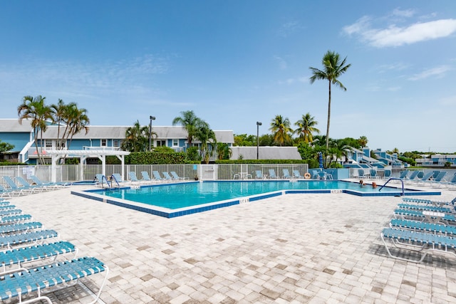 view of swimming pool featuring a patio area