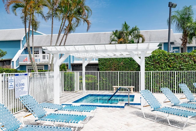 view of swimming pool featuring a pergola and a patio