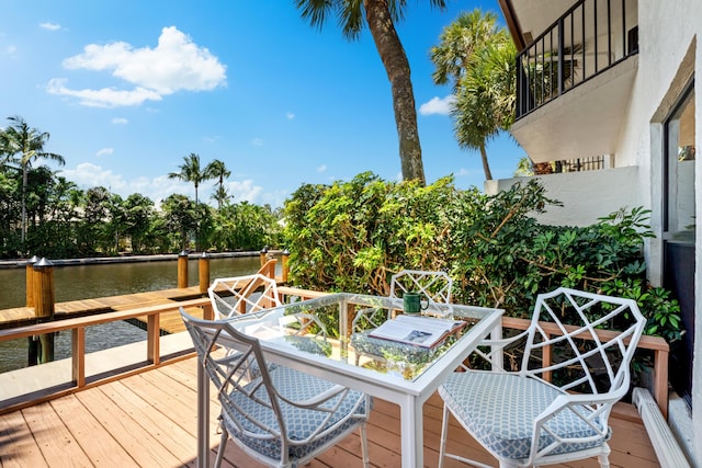 wooden terrace with a water view