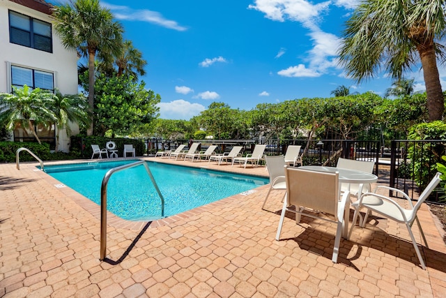 view of swimming pool featuring a patio