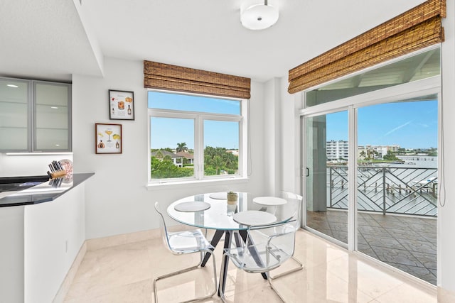 dining room featuring light tile patterned floors