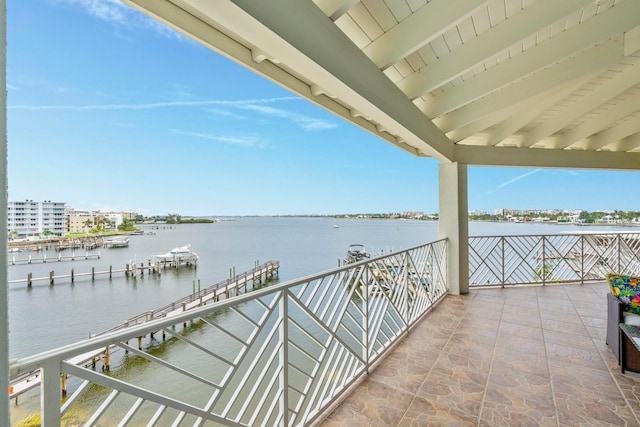 exterior space with a boat dock and a water view