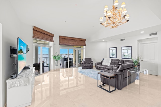 living room with an inviting chandelier and light tile patterned floors