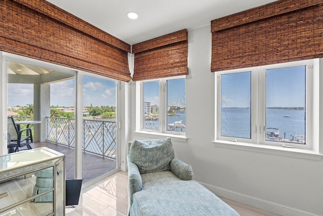 interior space featuring a water view and light wood-type flooring