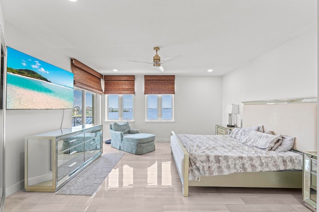 bedroom with ceiling fan and hardwood / wood-style floors