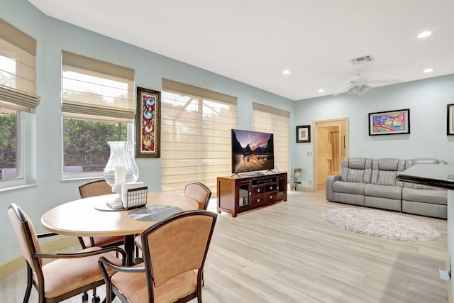 dining room featuring ceiling fan and light wood-type flooring