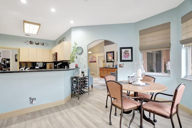 dining space with light wood-type flooring