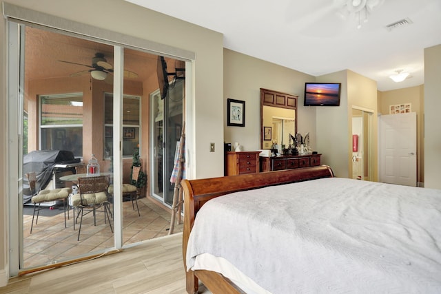 bedroom with light hardwood / wood-style floors and ceiling fan