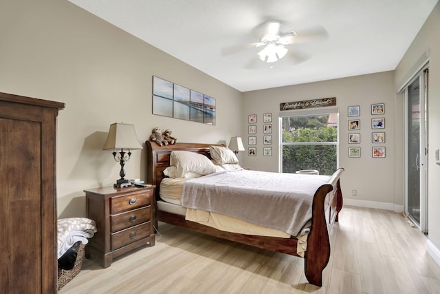 bedroom with light hardwood / wood-style floors and ceiling fan