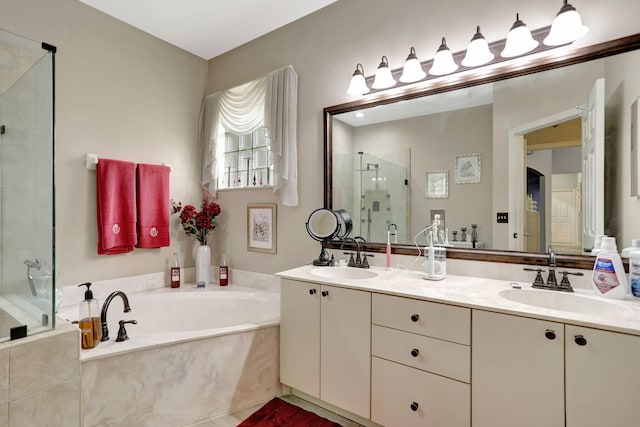 bathroom with separate shower and tub and double sink vanity