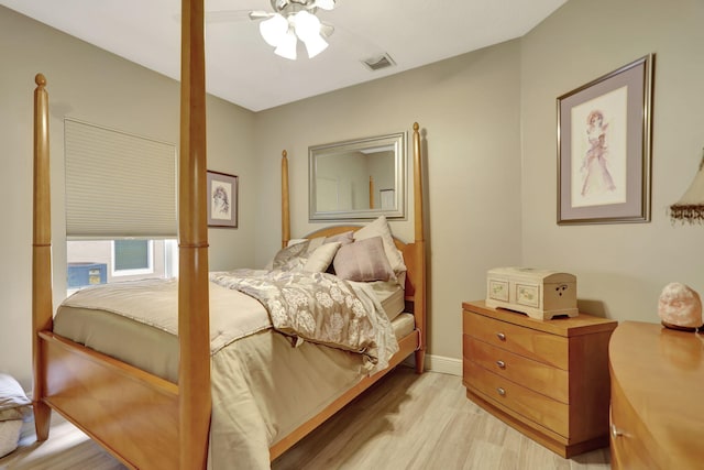 bedroom with ceiling fan and light wood-type flooring