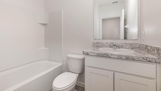 full bathroom with vanity, toilet, and  shower combination