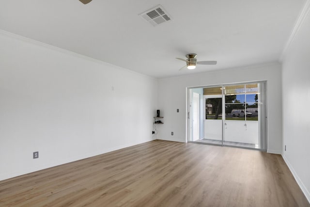 empty room with crown molding, ceiling fan, and light wood-type flooring