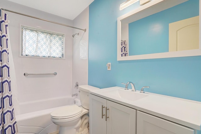 full bathroom with vanity, shower / bath combo with shower curtain, and toilet