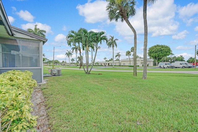 view of yard with central AC