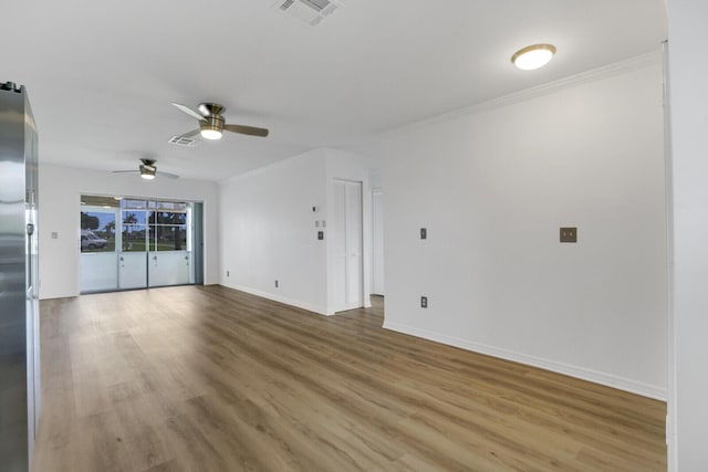 unfurnished living room with crown molding, hardwood / wood-style floors, and ceiling fan