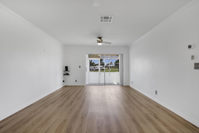 unfurnished room with crown molding, light hardwood / wood-style floors, and ceiling fan