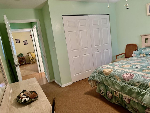 carpeted bedroom with a closet
