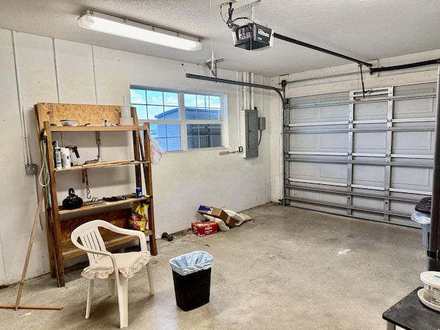 garage with electric panel and a garage door opener