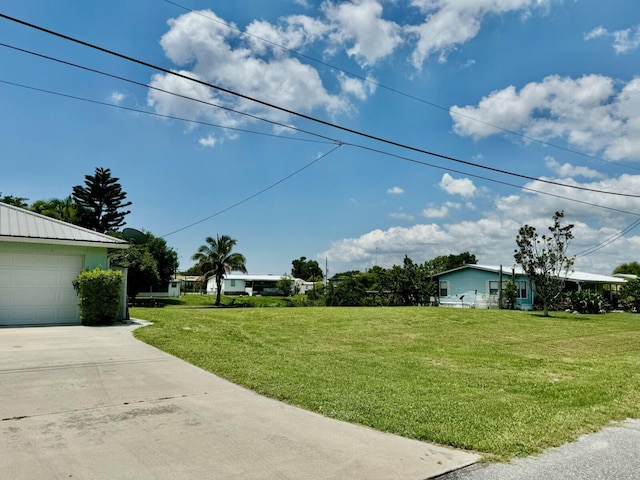 view of yard featuring a garage