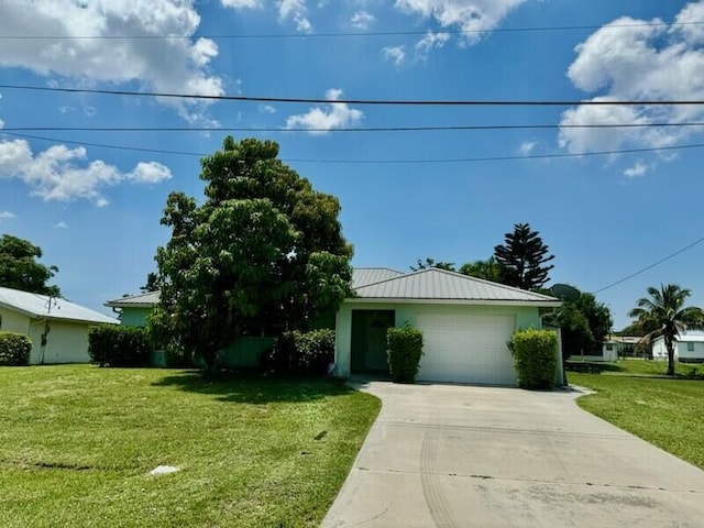 ranch-style house with a garage and a front yard