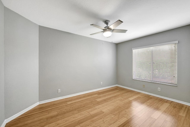 spare room with light hardwood / wood-style flooring and ceiling fan