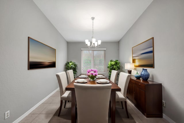 tiled dining area with an inviting chandelier