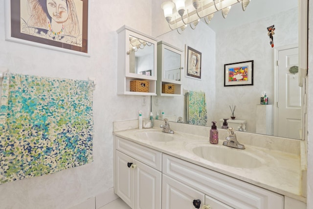 bathroom with vanity, toilet, a chandelier, and tile patterned floors