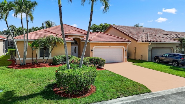 mediterranean / spanish-style house featuring a garage and a front lawn