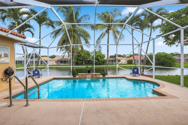 view of pool with pool water feature and glass enclosure