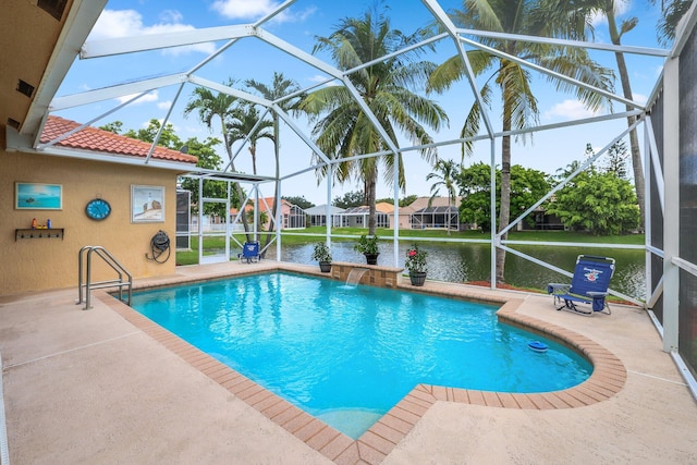 view of pool with a patio area, a lanai, a water view, and pool water feature