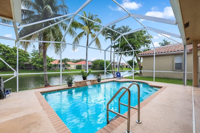 view of pool with a patio, a water view, pool water feature, and glass enclosure