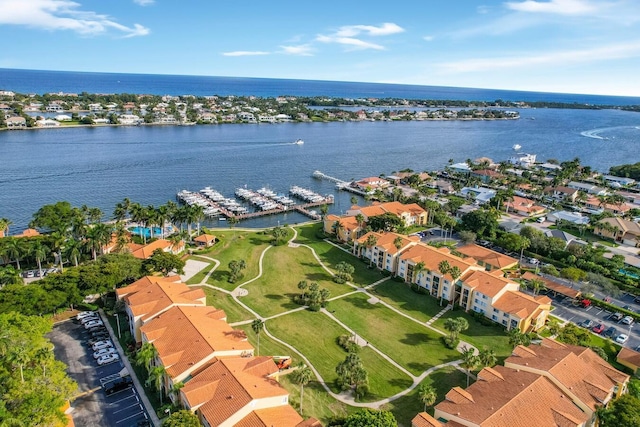 birds eye view of property with a water view