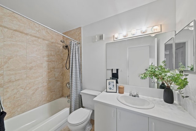 full bathroom featuring vanity, shower / bath combination with curtain, and toilet