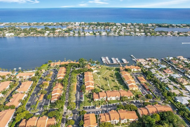 birds eye view of property featuring a water view