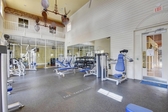 workout area with a high ceiling