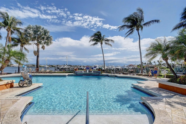 community pool featuring a patio area