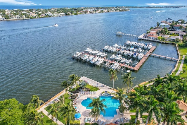 birds eye view of property with a water view