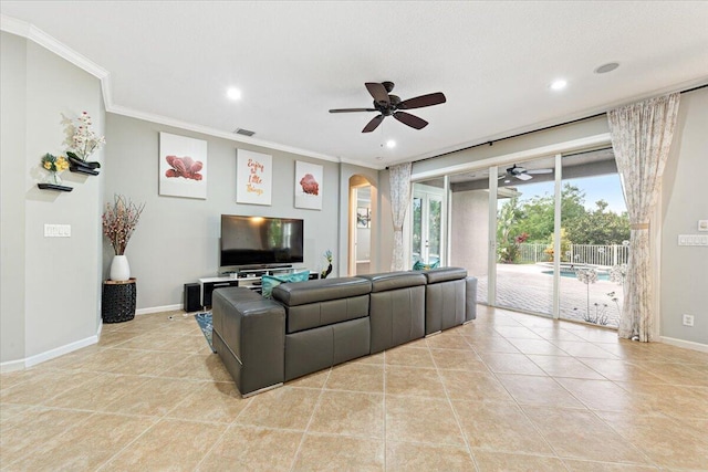 tiled living room with ceiling fan and crown molding