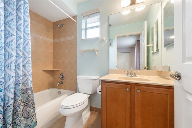 full bathroom featuring toilet, vanity, tile patterned floors, and shower / tub combo with curtain