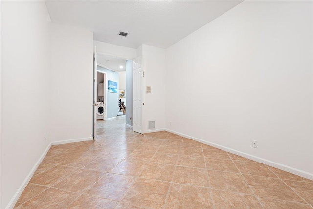 spare room featuring washer / dryer